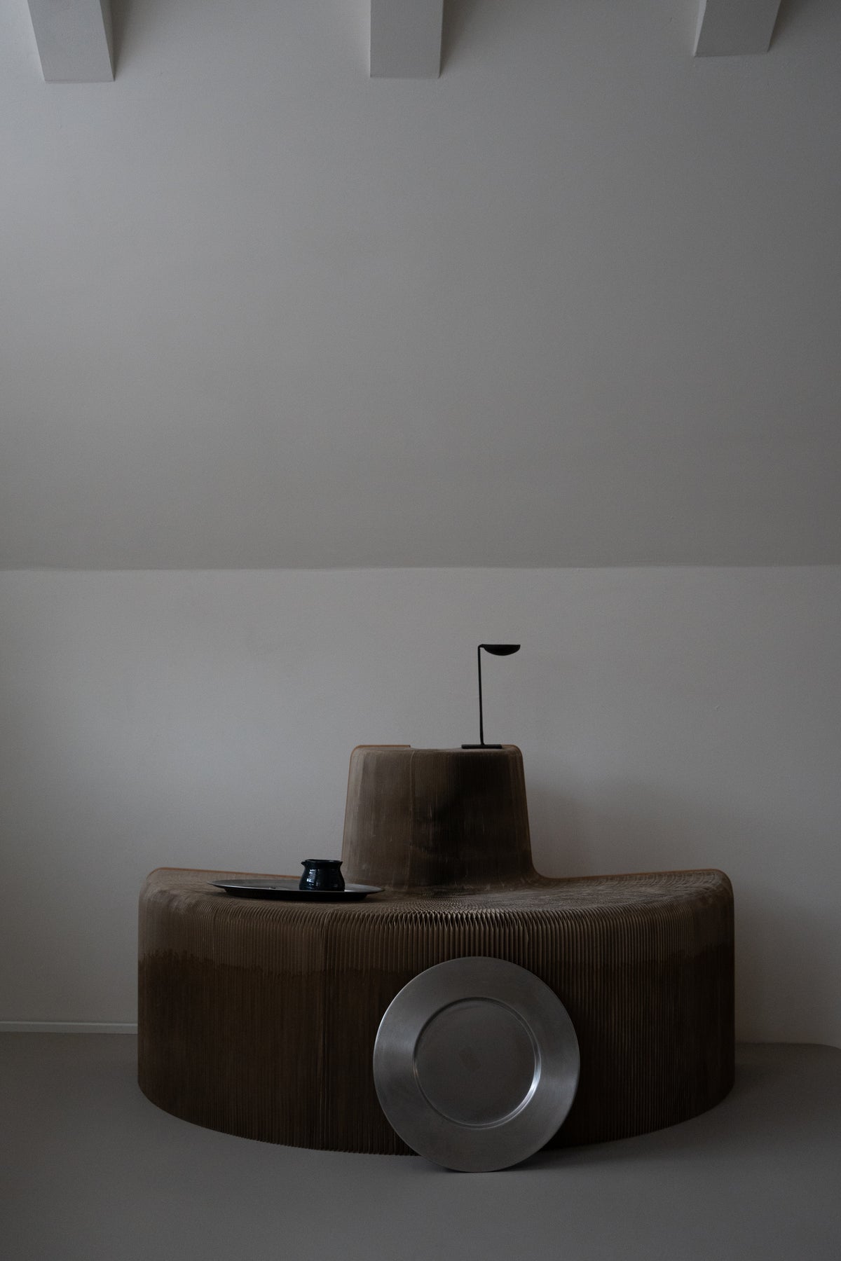 Set of minimalist stainless steel charger plates by Zack