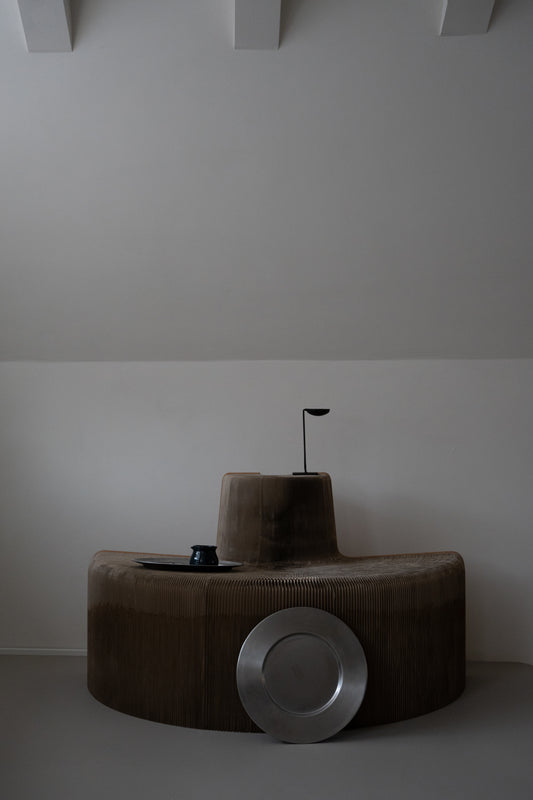 Set of minimalist stainless steel charger plates by Zack