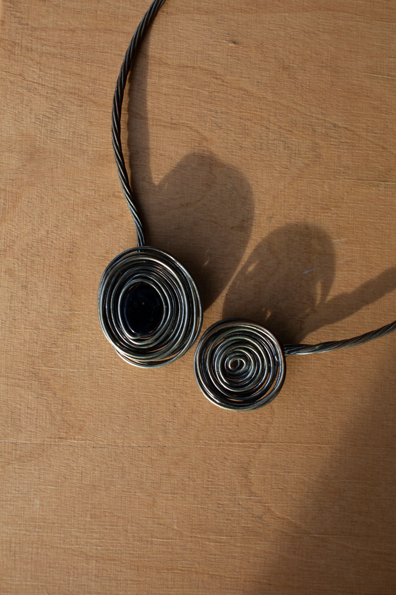 The Double Orbit Neck Piece