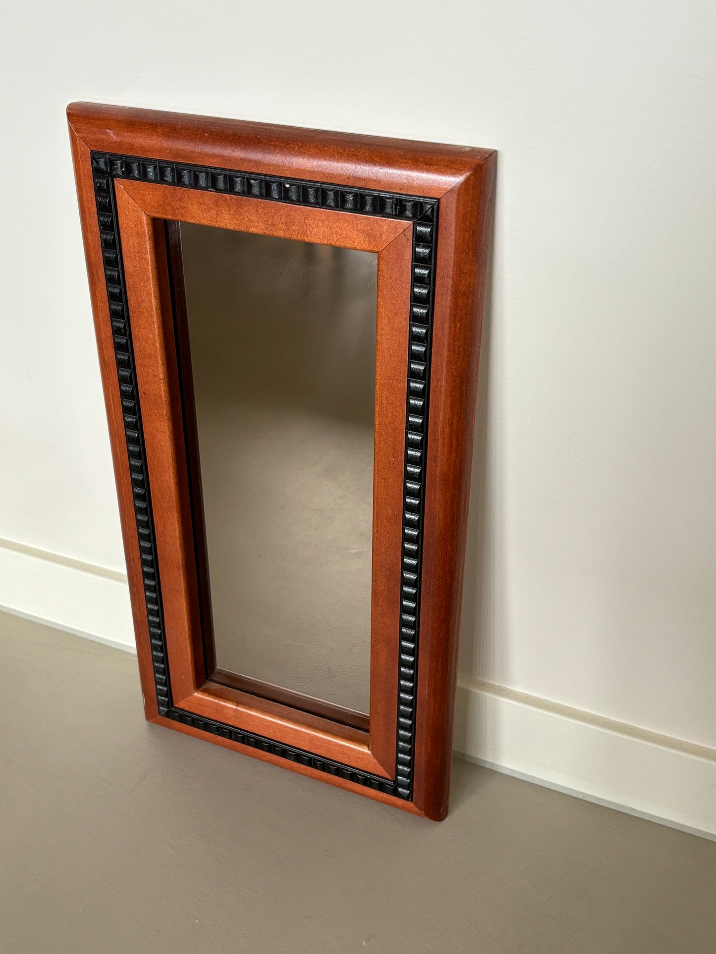 Mirror with black wooden details