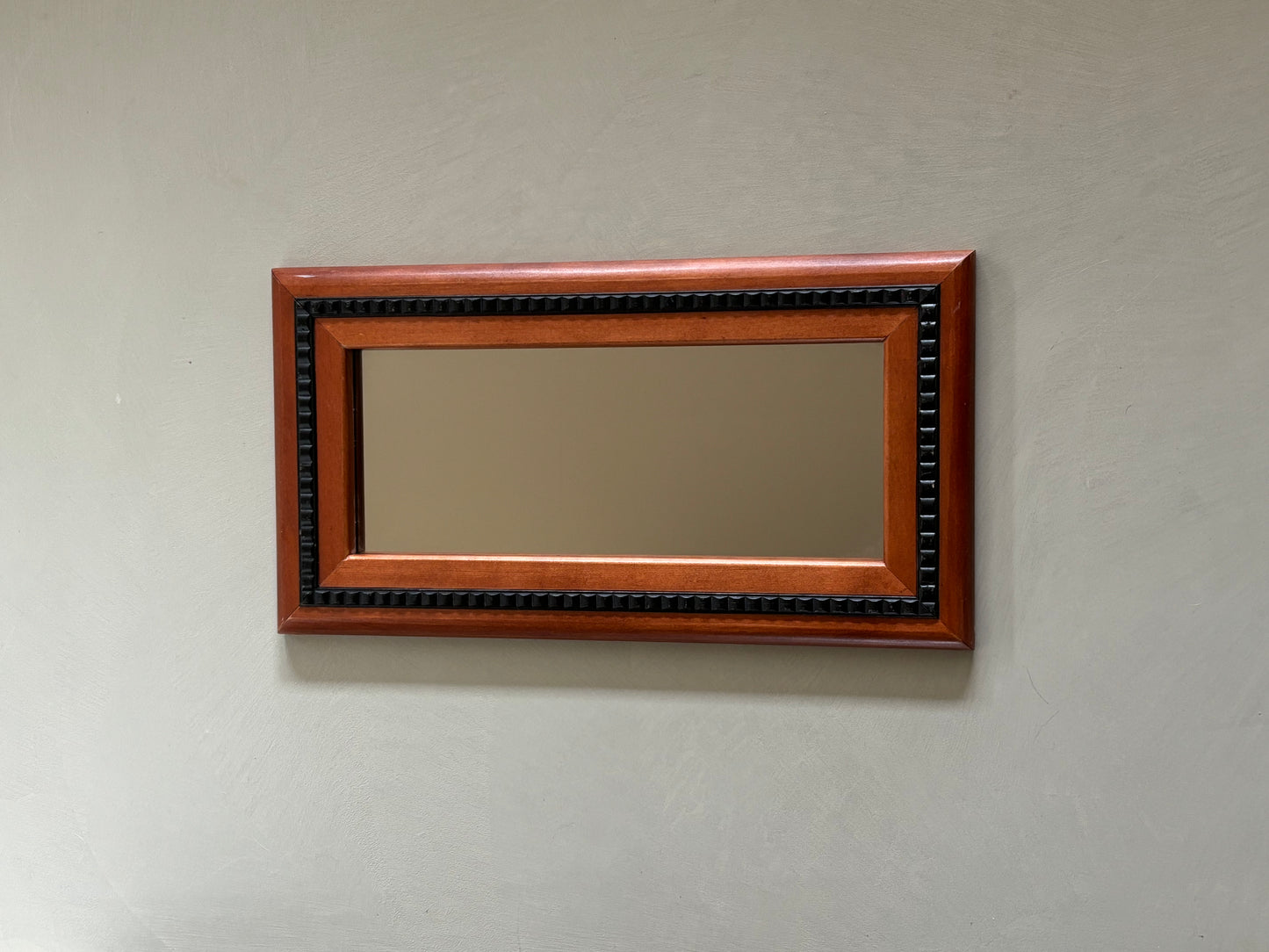 Mirror with black wooden details