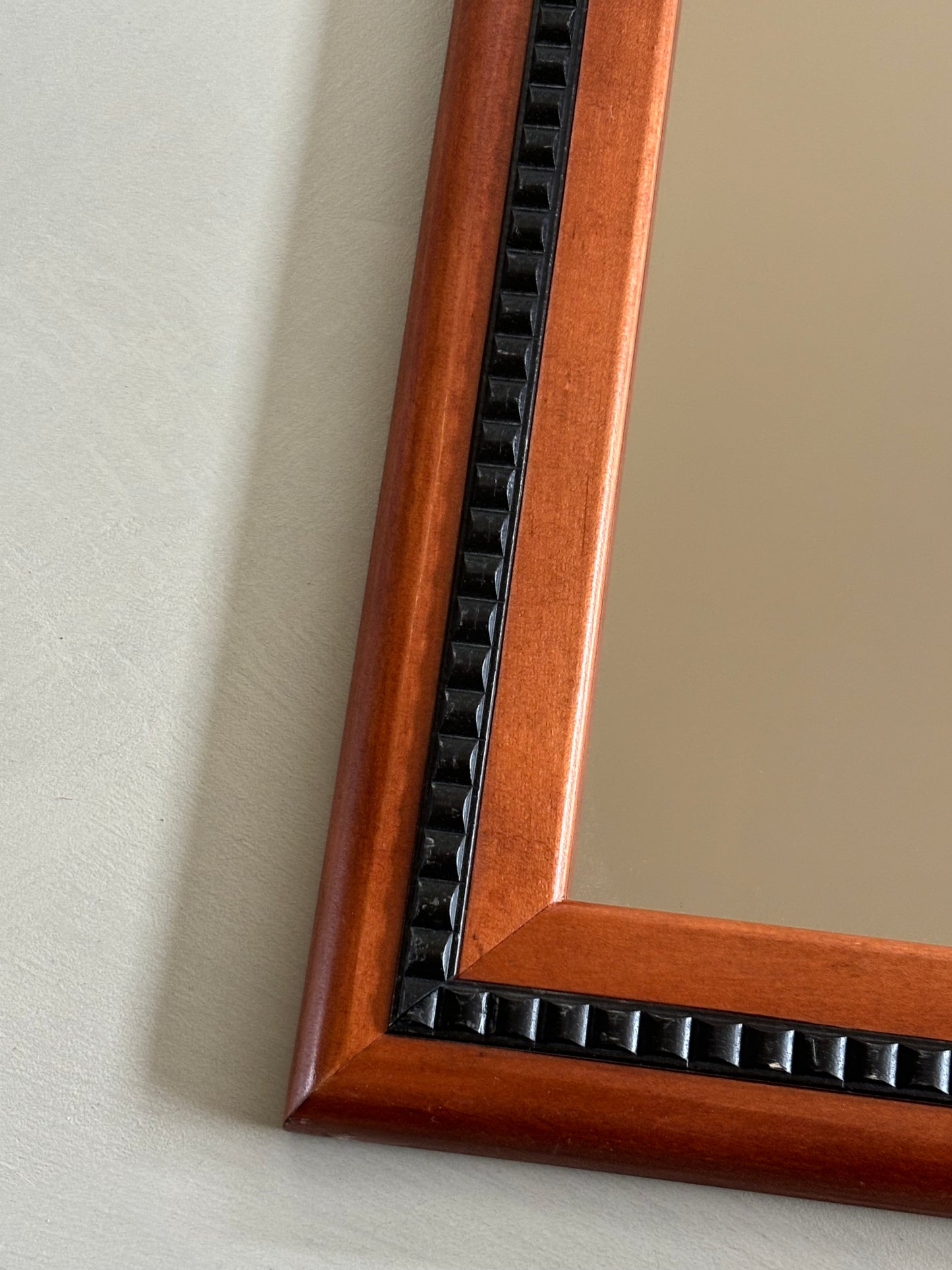 Mirror with black wooden details