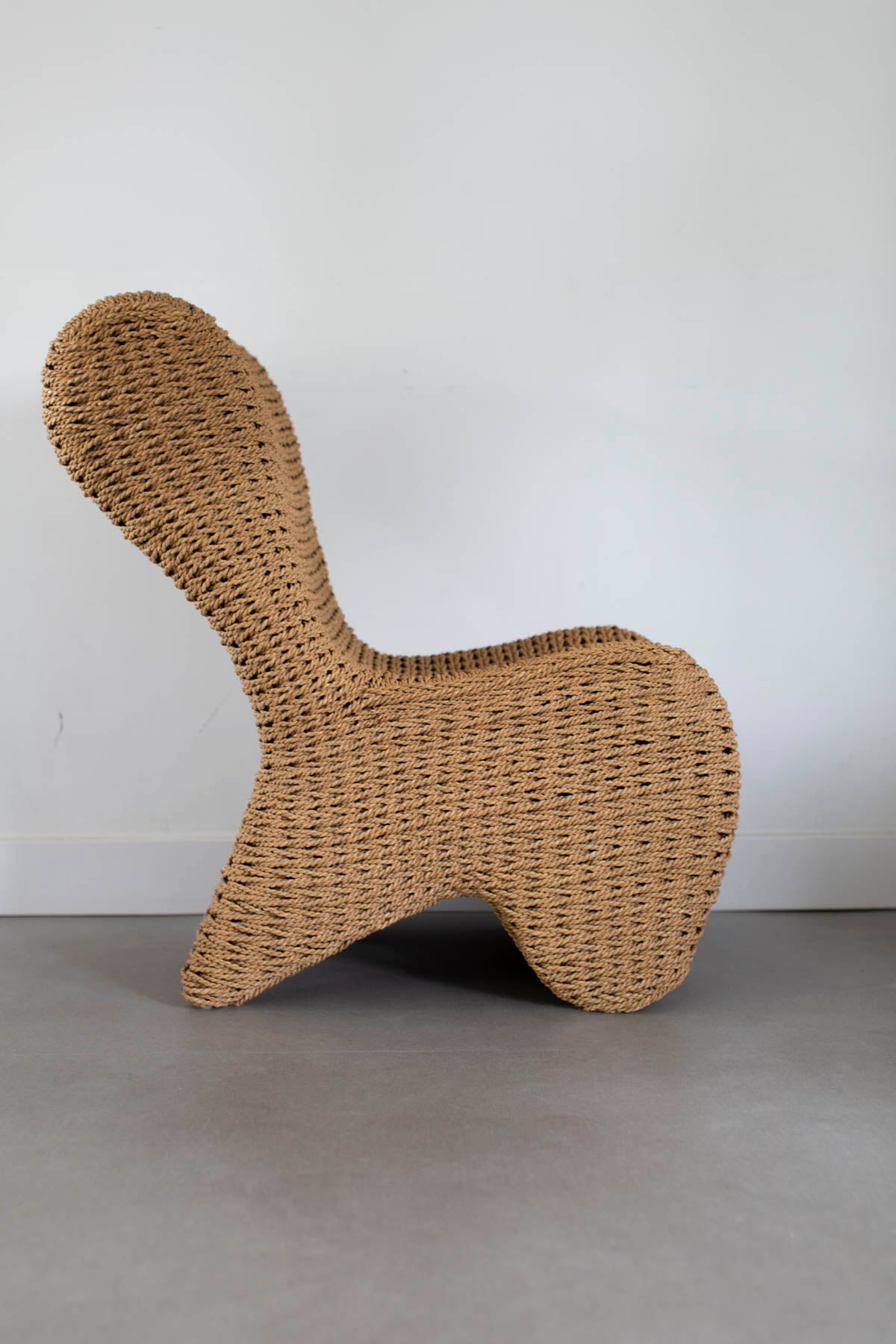 Sculptural rattan chair (rent only)