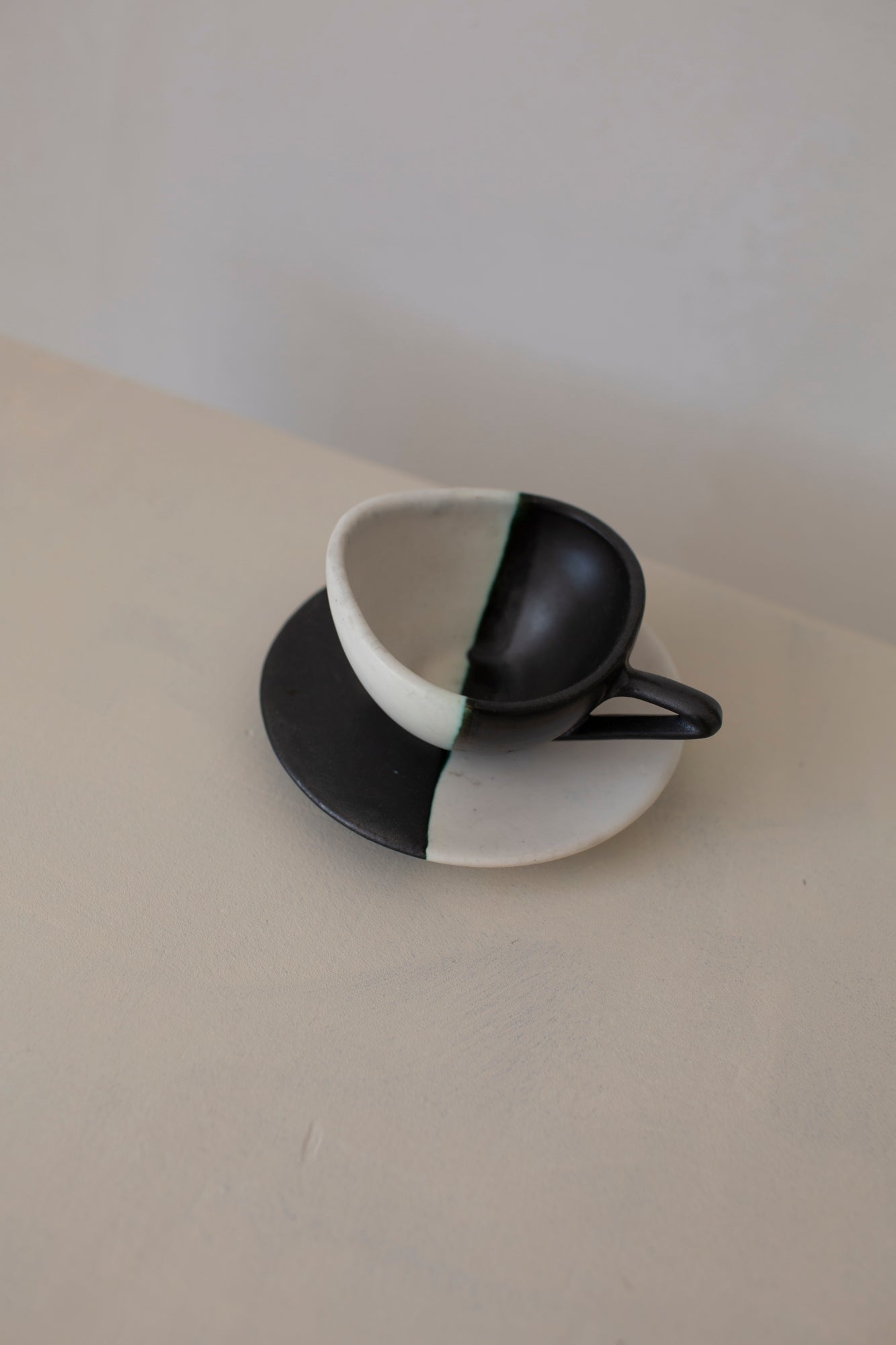 Sculptural black & white ceramic espresso cup