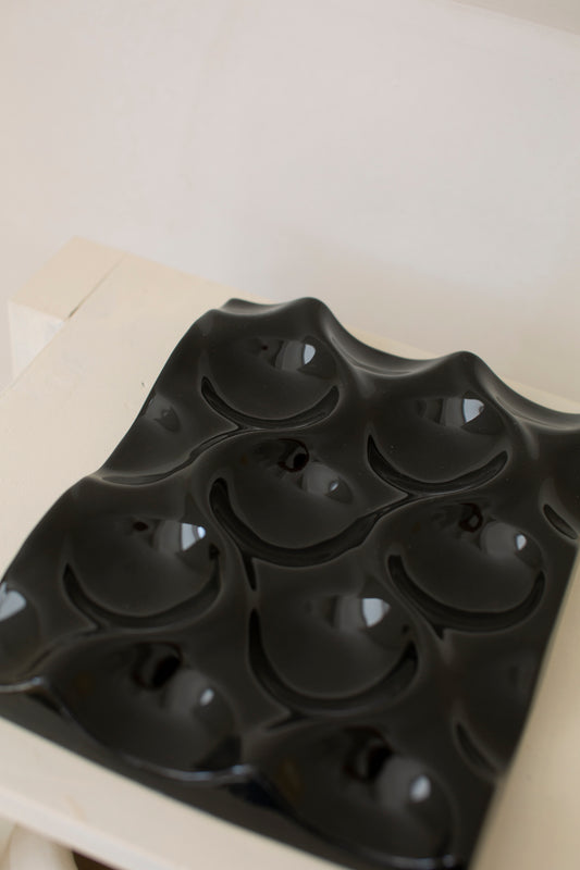 Black glazed ceramic object / fruitbowl