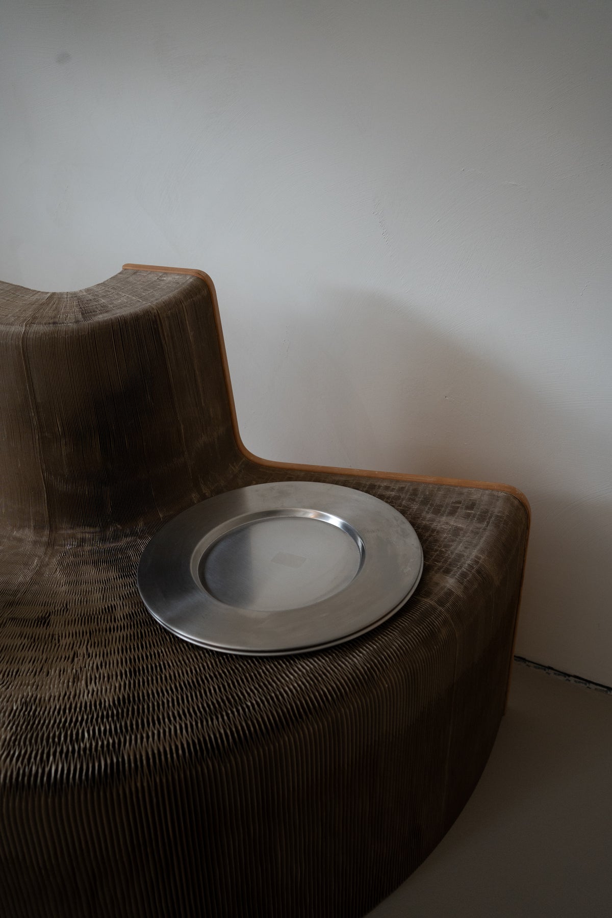 Set of minimalist stainless steel charger plates by Zack