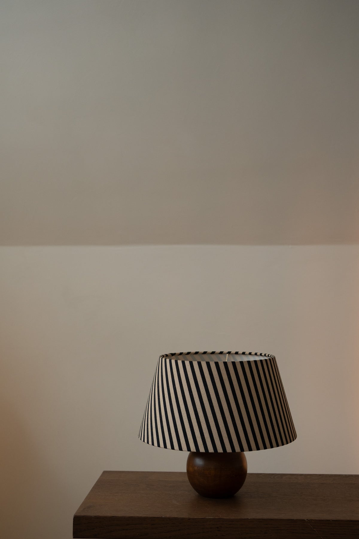 Vintage solid wood sphere table lamp with striped shade
