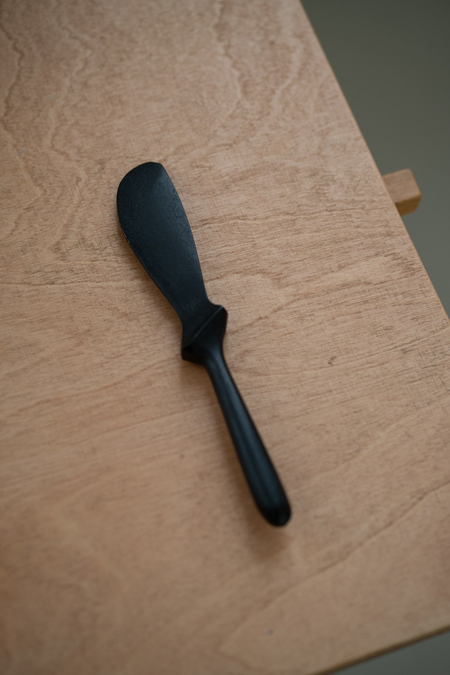 Hand carved black wooden knife