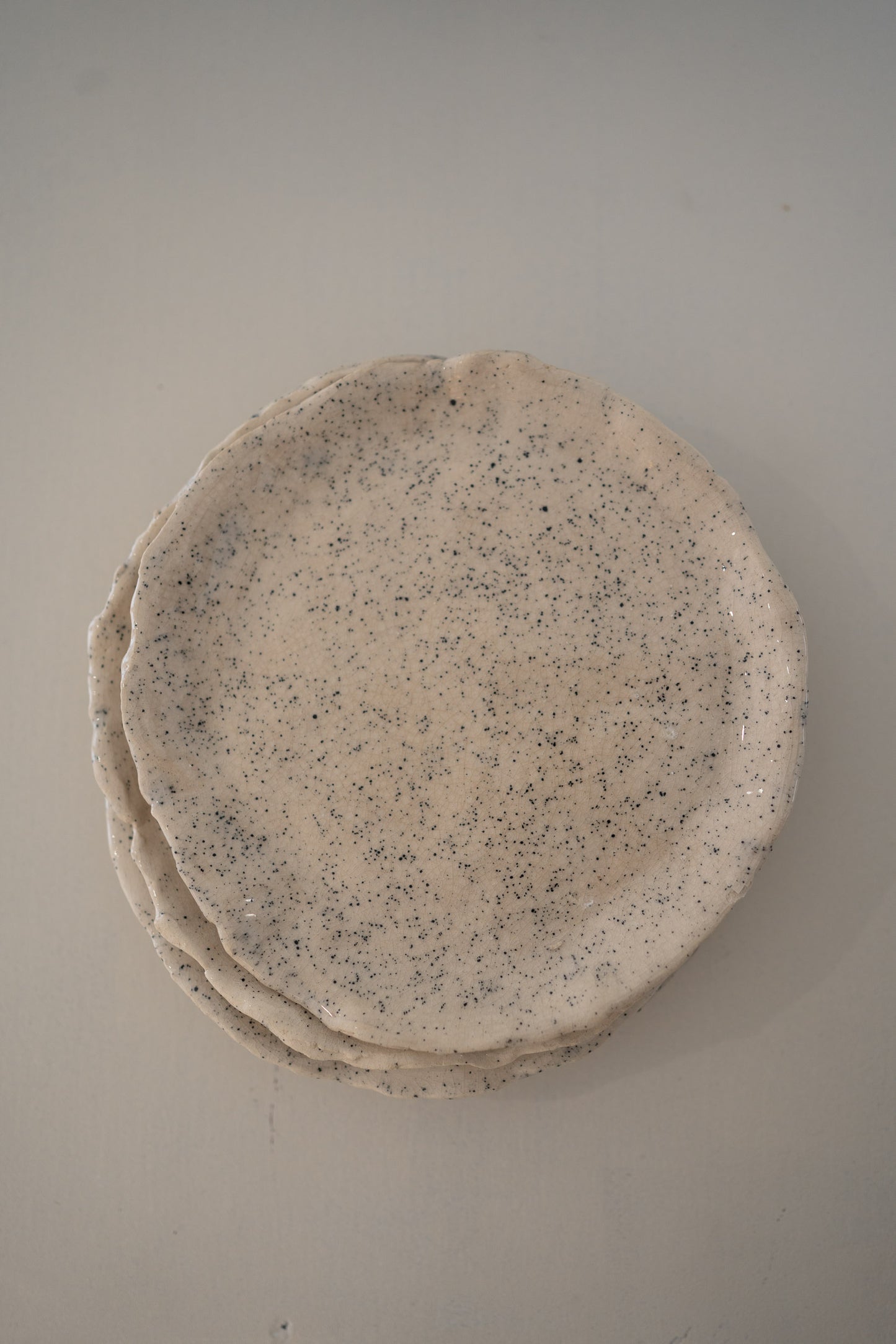 Set of  4 handcrafted speckled ceramic plates