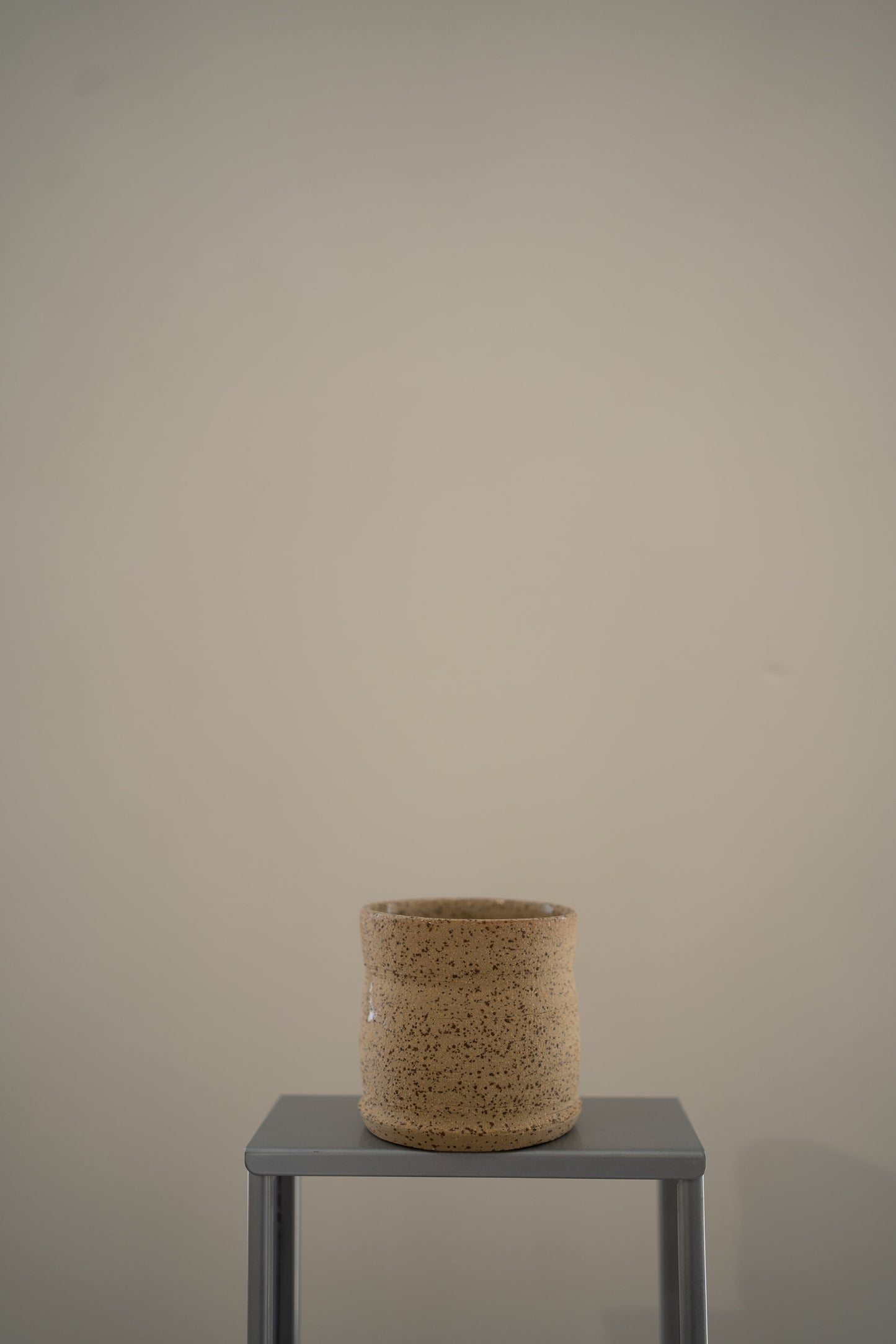 Speckled ceramic coffee cup
