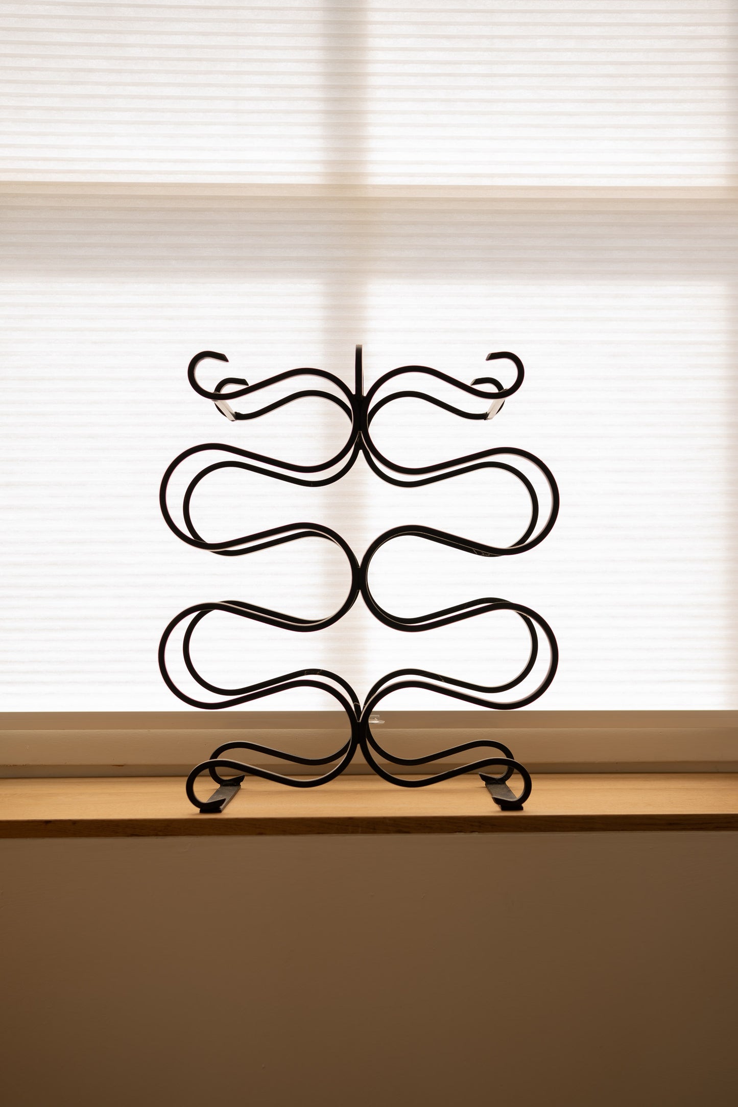 Vintage sculptural iron wine rack