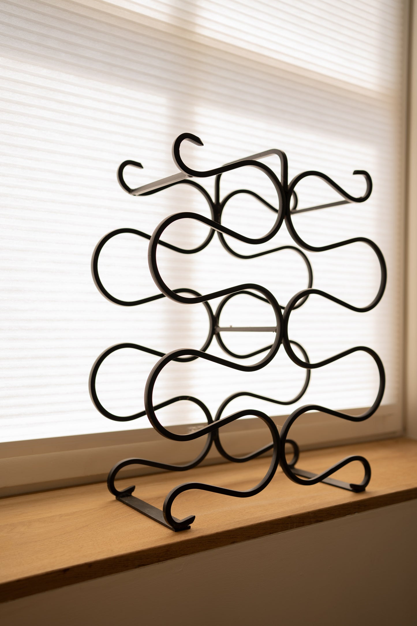Vintage sculptural iron wine rack