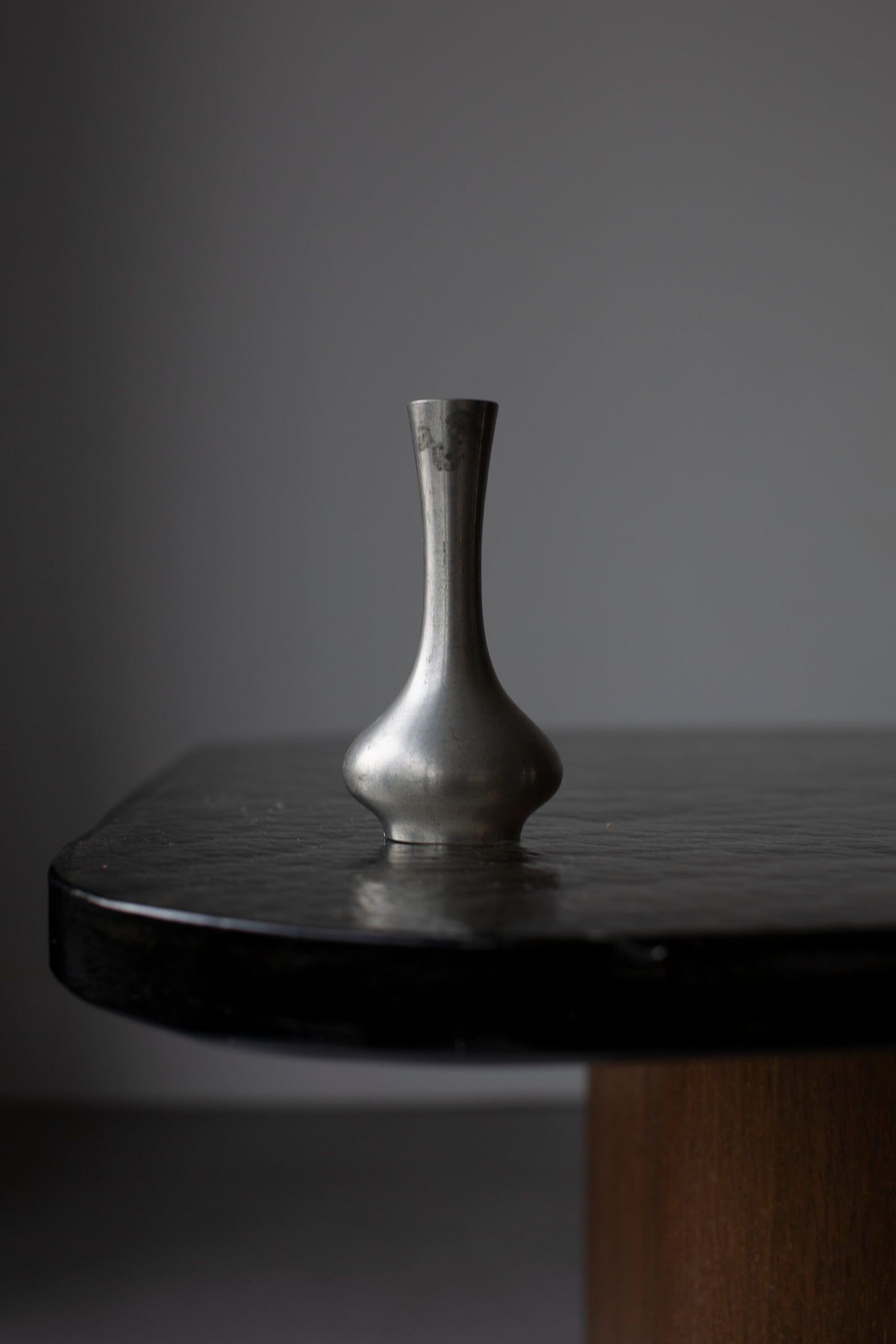 Heavy glass table on wooden pedestal