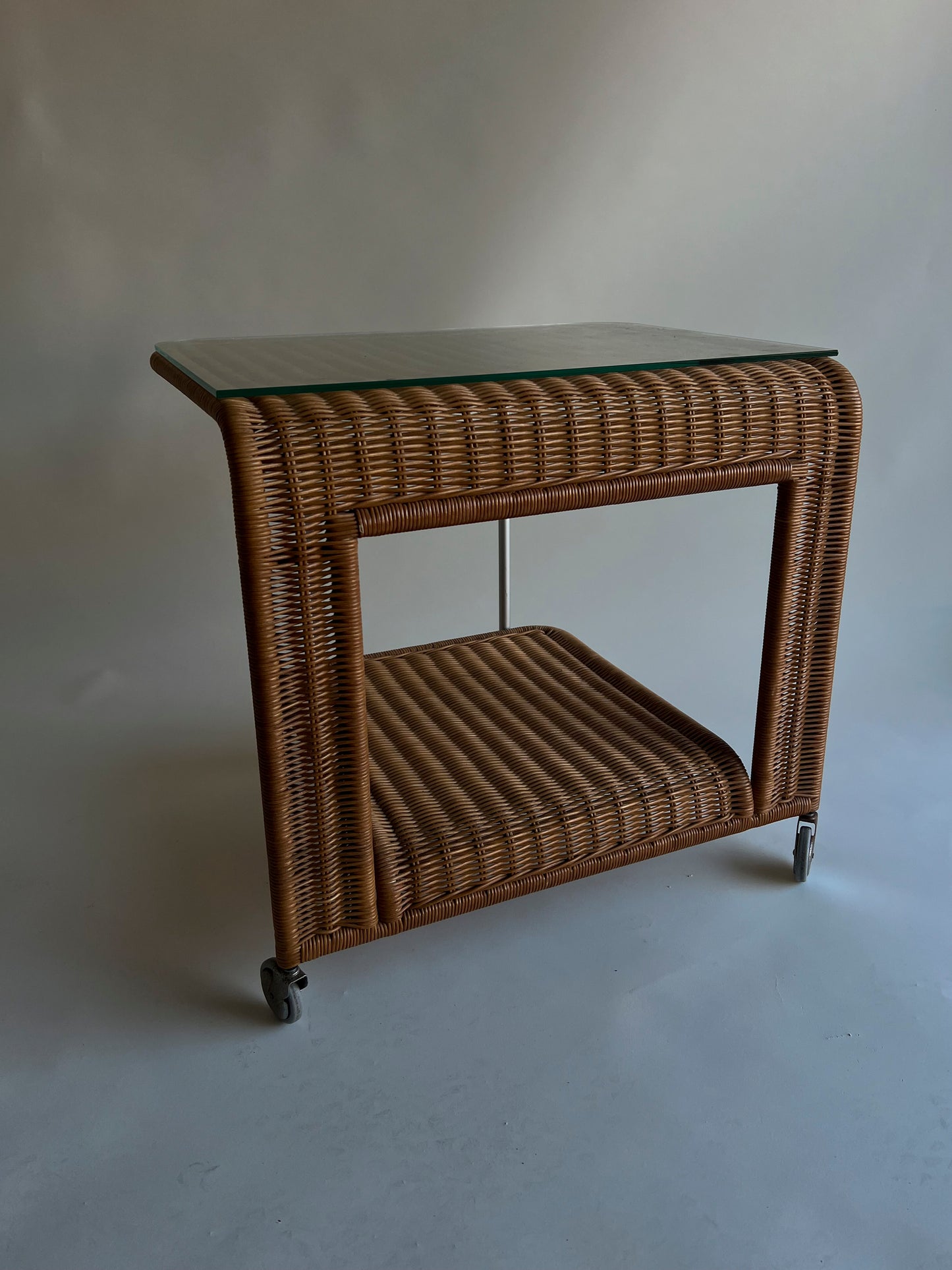 Vintage rattan trolley with glass top