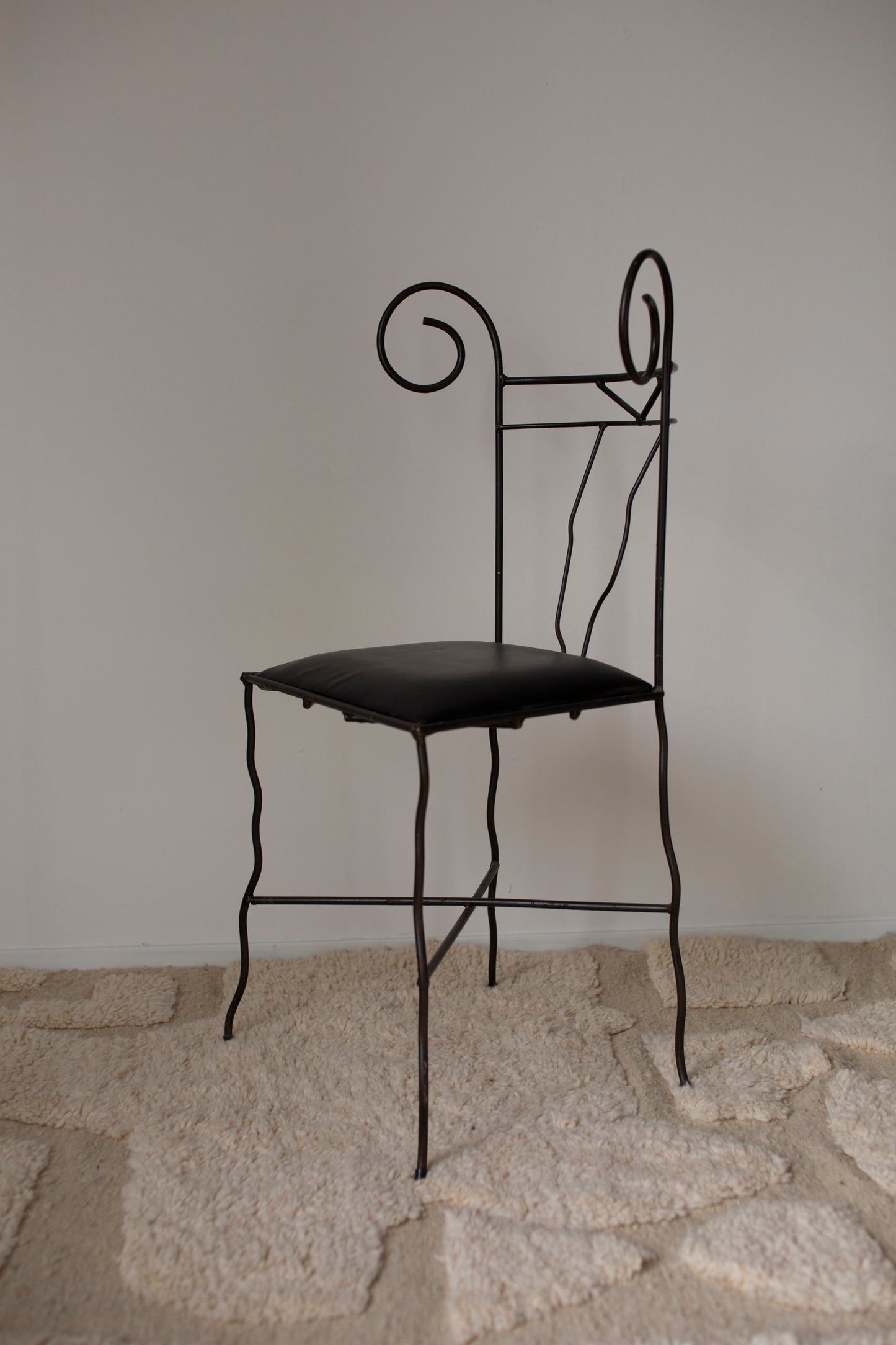 Cast iron chair with leather seat