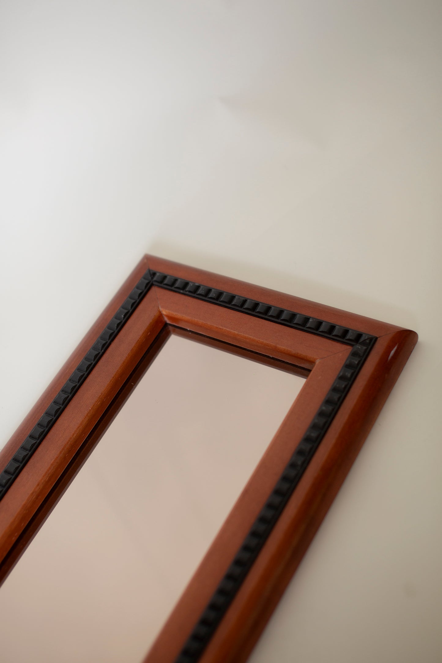 Mirror with black wooden details