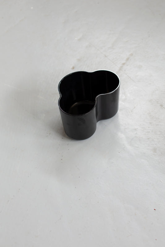 Curved black object
